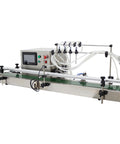 Zero Fuss Automatic Desktop 4 Head Liquid Filling Machine With Digital Controls And Rock Solid Stainless Steel Frame For Slick Dosing Of Drinks Beauty Products And Syrups 110V on a clean surface with control panel.