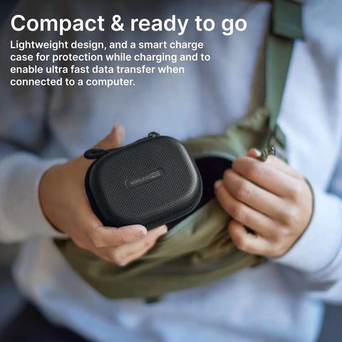 Person holding Wireless Pro Compact Wireless Microphone System With Timecode And 32 Bit Float Onboard Recording smart charge case.
