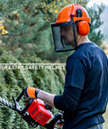 All In One Industrial Forestry Safety Helmet With Adjustable Mesh Face Shield And Ear Muffs For Chainsaw Use Eye And Hearing Protection Arborist Gear Pro Grade PPE For Outdoor Forestry Tasks Orange worn by a person using a chainsaw in a garden setting