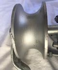 Close-up of gray metal rear pipe track wheel for chain link sliding gates, showing rugged design and screws, heavy duty hardware.