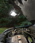 20V Power Share LED Work Light With 1500 Lumens, Ultra Portable Job Site Lantern illuminating an open car hood engine