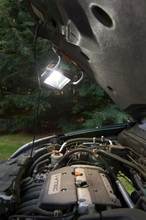 20V Power Share LED Work Light With 1500 Lumens, Ultra Portable Job Site Lantern illuminating an open car hood engine