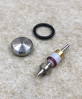 Waterjet on/off valve repair kit components: metal valve stem with brass collar, white/purple insert, and black O-ring.