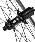 Close-up of hub on 38mm Tubeless Disc Brake Road Wheelset 700c Carbon Fiber Toray T700 with 11-12 speed Shimano compatibility.