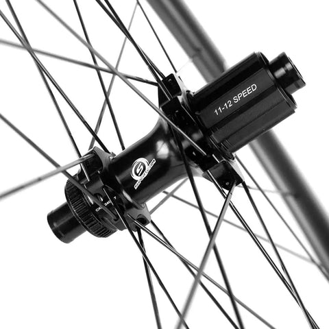 Close-up of hub on 38mm Tubeless Disc Brake Road Wheelset 700c Carbon Fiber Toray T700 with 11-12 speed Shimano compatibility.