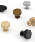 Assorted round cabinet knobs in various finishes including antique brass, showcasing the design and variety available.