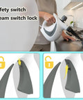 Hella Strong Handheld Steam Cleaner With 12 Nifty Tips For Banishing Stubborn Stains On Auto Upholstery Tile Floors And Fabric Couches In Sharp Deep Gray Body showing safety switch and steam switch lock.