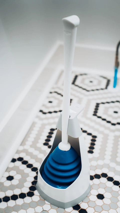 Top Shelf Toilet Plunger With No Drip Carrying Caddy And Suction Lock Seal, blue and white, on hexagonal patterned floor.