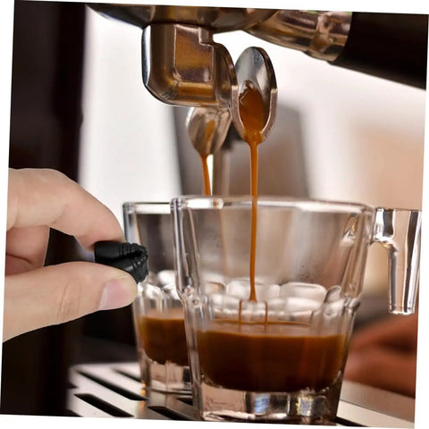 Two Pack Espresso Steam Wand Rubber Sleeve Covers for heat safety, black rubber guard being used by hand next to coffee cups