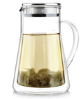 Top Tier Double Walled Insulated Teapot That Keeps Your Daily Brew Sizzling Hot With Slick Stainless Steel Filter Lid For Loose Leaf Tea And Tea Maker For Two Crew Who Want Zero Clutter, showing a glass teapot with loose leaf. 