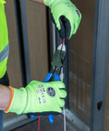 Person using Heavy Duty 9 Inch Ironworker Pliers For Rebar ACSR Screws Nails And Hardened Wire, High Leverage Side Cutters