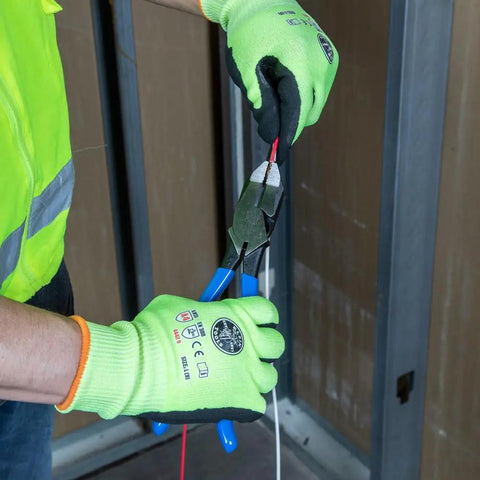 Person using Heavy Duty 9 Inch Ironworker Pliers For Rebar ACSR Screws Nails And Hardened Wire, High Leverage Side Cutters