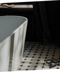 Bathroom with white freestanding bathtub and black-and-white tiled floor, displaying a DIY Hexagon Cement Floor Mold For Garden Paths And Patios.