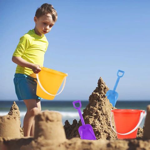 Child playing with orange bucket from 12 Pack 5 Inch Beach Buckets With Shovels Set For Kids Colorful Sand Pails Water Buckets Beach Toys