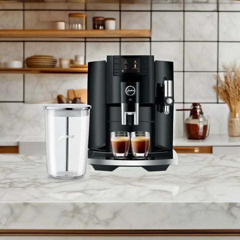 Next Level 5th Gen Automatic Smart Coffee Machine Bundle Featuring Piano Black Finish Plus Matching Glass Milk Frothing Container on marble countertop