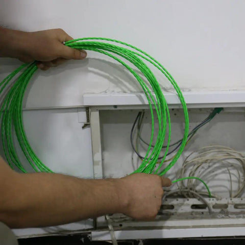 Get The Job Done Fast With This 32 Foot Plastic Coated Steel Fish Tape Wire Puller, flexible tape held above conduit.