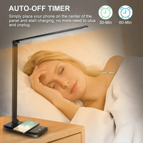 Wireless Charging Desk Lamp With USB Port Dimmable Office Light Featuring Five Modes And Ten Brightness Levels beside a sleeping person