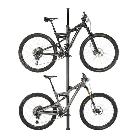 Vertical Tension Floor To Ceiling Bicycle Storage Column For Two Bikes Black Aluminum Hanger Adjustable From 2.1m To 10m Space Saving Slick Modern Design For Home Garage Or Studio shown with two bikes mounted side by side, made of black aluminum with a sleek finish.
