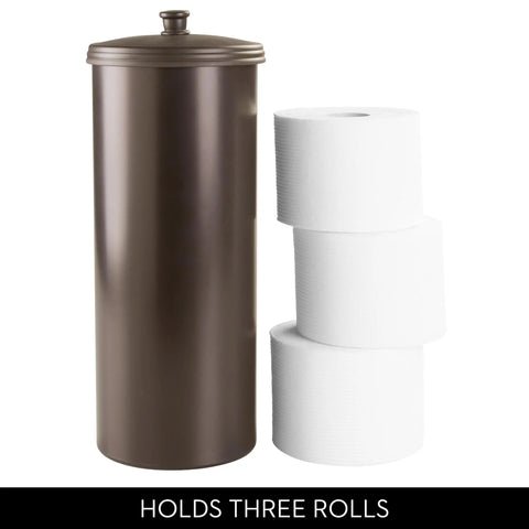 Freestanding Bronze Toilet Paper Holder With Lid For Three Extra Rolls next to three white toilet paper rolls.
