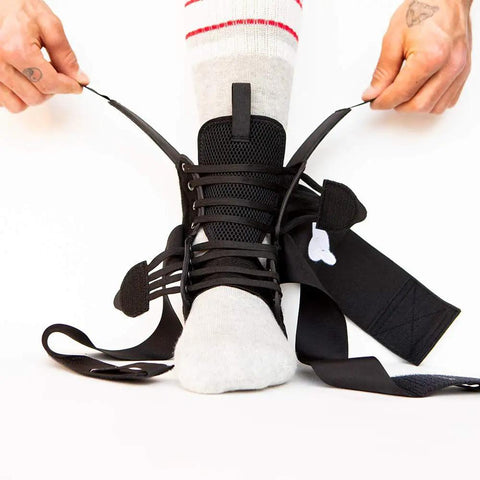Person slipping on Dope Quick Lace Ankle Brace 2.0 For All Sports Enthusiasts, focusing on unisex quick lace support.