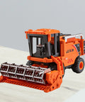 Durable Combine Harvester Toy For Kids And Boys Farm Tractor With Realistic Farmer Model Car Design In Orange on table