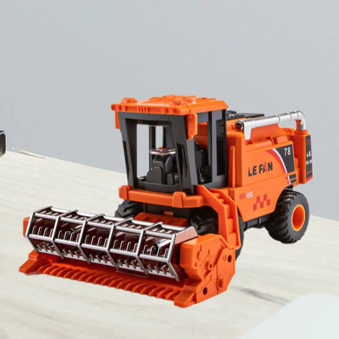 Durable Combine Harvester Toy For Kids And Boys Farm Tractor With Realistic Farmer Model Car Design In Orange on table