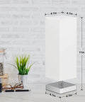 Cozy Minimalist Table Lamp For Bedroom Bedside Nightstand With Square Fabric Shade, Desk Reading Light For Kids Room Living Room Or Office, White Shade And Silver Base, UL Listed, shown on a desk