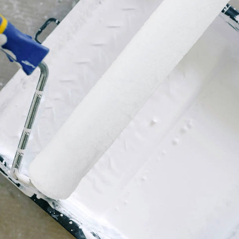 Pro Grade White Fiber Paint Roller Sleeve For Walls With No Fuss Washable Refill Design Featuring Ridiculously Smooth Roll Texture And Dependable Small Size Covers For Quick Home Glow Up, close-up of white roller in paint tray.