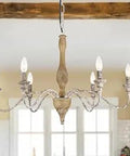 Farmhouse 6 Light French Country Candle Chandelier With Rustic Wood Finish 30 Inch Wide Perfect For Living Room Dining Room And Bedroom Retro Style Lighting Fixture For Cozy Vibes hanging in a room with window view.