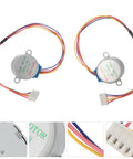 Two Pack Precision Stepper Motors For Cnc Engraving And Milling Machines with colored wires, compact silver bodies, and connectors.