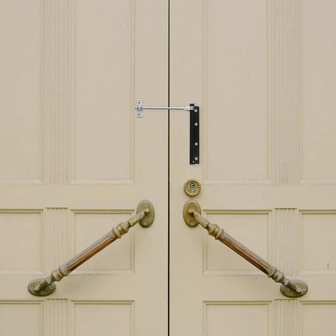 Automatic Door Closer For Doors And Gates With Silent Design Easy Install Heavy Duty Stainless Steel Construction shown on beige doors