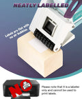 Portable Handheld Label Applicator Gun For Barcodes And Stickers applied label flat with no air bubbles on a wooden block.