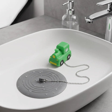 TEHAUX Silicone Bathtub Drain Stopper 15cm, Hair Catcher for Bathroom with playful green toy car in sink.