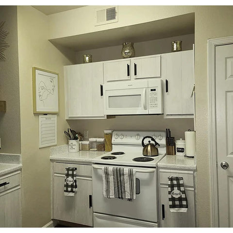 Kitchen with cabinets featuring 16 Pack Self Stick Push Pull Helper ABS Plastic Wardrobe Handle For Cabinets And Drawers in black.
