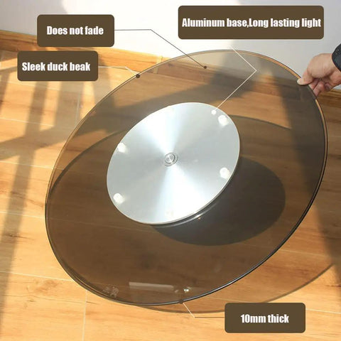 Big Round Glass Lazy Susan Turntable For Dining Table with aluminum base, quiet bearings, 90 cm tabletop shown from side angle