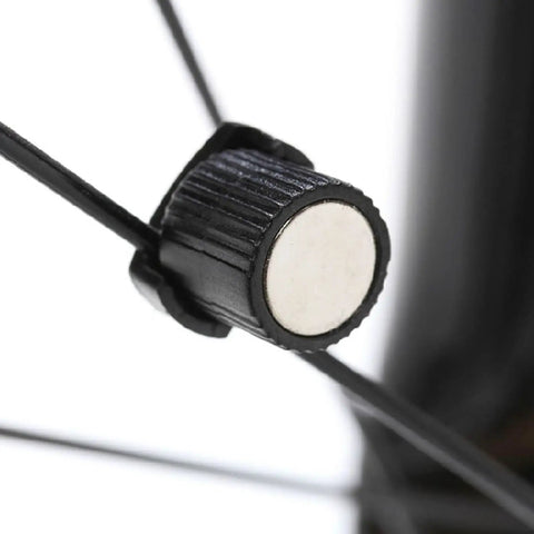 Close-up of Two Pack Bike Speedometer Wheel Magnets for Spoke Sensor on bicycle spoke.
