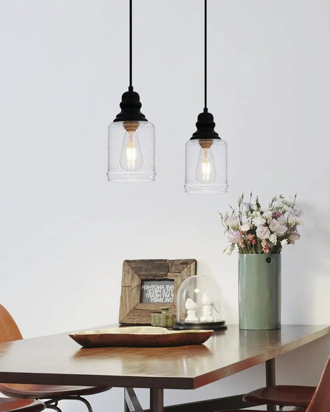 Slick Five Point Five Inch Seeded Glass Mini Pendant Light Featuring Badass Black Metal Hanging Fixtures For Kitchen Island And Dining Room with flowers.