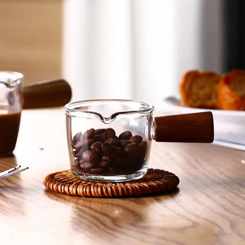 Single Spout Espresso Shot Glass With Wood Handle Measuring Cup Set, 75 Ml Two Pack, Borosilicate Glass Milk Cup On Table
