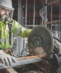 Worker using 12 Inch Segmented Rim Diamond Edge Cutoff Wheel for Metal, 1 Inch Arbor, wet or dry use, cutting steel beam