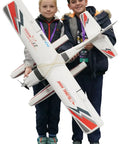Children holding RC Seaplane Trainer With Floats Included, 2.4 GHz 1.2m Grab And Go Ready To Fly Aircraft, 4 Channel RTF