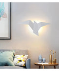 Top Shelf Sleek Iron Wall Sconce Delivering Snazzy Nordic Led Lighting For Bedrooms Hallways And Staircases With Rock Solid Craftsmanship That Keeps Things Looking Fresh Year After Year mounted above a sofa.