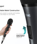 Person holding Karaoke Dynamic Vocal Microphone For Stage And Home Use 6.35mm Wired Handheld Mic With On Off Switch