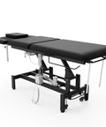 Black Electric Spine Massage Table With Dual Motors And Hydraulic Lift Adjustable Waist Support For Physical Therapy Facial Spa Waxing And Tattoo Clinics Versatile Treatment Bed with control panel and adjustable features.