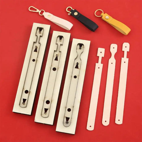 Three Piece Long Keychain Cutting Mold Set With Dog Paw Pattern Punch Tool For DIY Leathercraft on red background