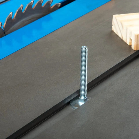 Beefy One Quarter Twenty Miter T Slot Bolts inserted in a table saw miter slot with a wooden fixture nearby, ideal for fixturing.