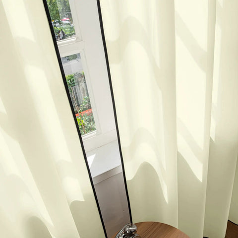 Light Yellow Semi Sheer Curtains Two Panels 84 Inches Long 52 Inch Wide Light Filtering Window Drapes installed in a living room