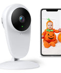 1080P Indoor Baby Cam With Audio And Night Vision Nanny And Pet Surveillance Camera With Sound And Motion Alerts Two Way Talk Remote Viewing Easy Setup White next to phone displaying baby.