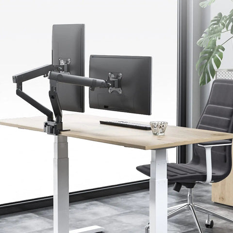Adjustable Dual Monitor Arm Desk Mount With Smooth Mechanical Spring Height Tilt Swivel Rock Solid Clamp Base for dual screens on a wooden desk.
