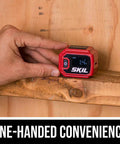 Compact Digital Level With Line Laser For Quick, Accurate Leveling Real Time Display And Easy Alignment Laser Line Projection On Walls Or Floors Built In Protractor Lightweight And Handy For Tight Spots And On The Go Projects. red digital level on wood beam, one-handed use