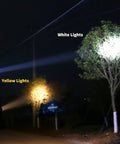 White and yellow light beams from Rechargeable LED Headlamp With External Battery Pack, 3 Lighting Modes, illuminating trees at night